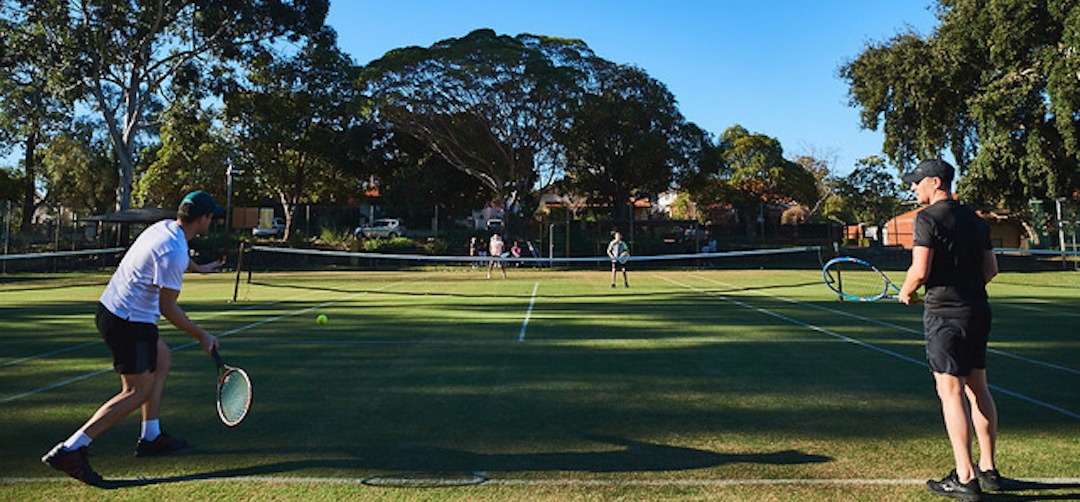 four people playing tennis at Daglish tennis club
