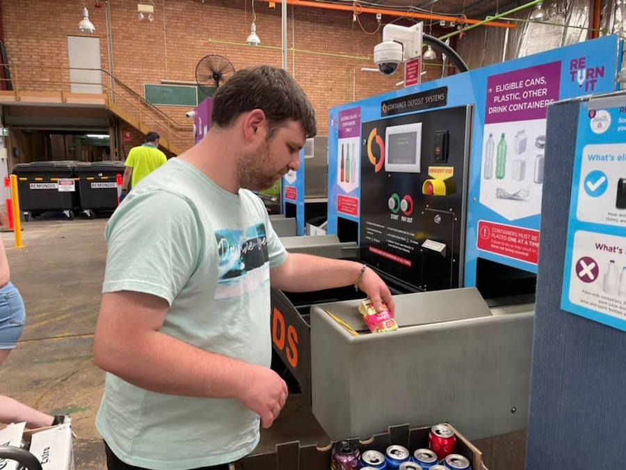 Cameron Collects in action: side angle of Cameron dropping off the containers he has collected at Shenton Park Containers For Change Centre