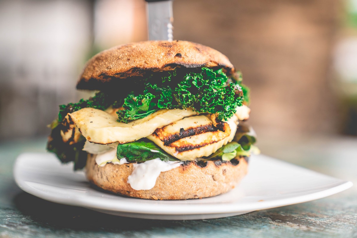 Healthy fast-food burger with grilled chicken and kale